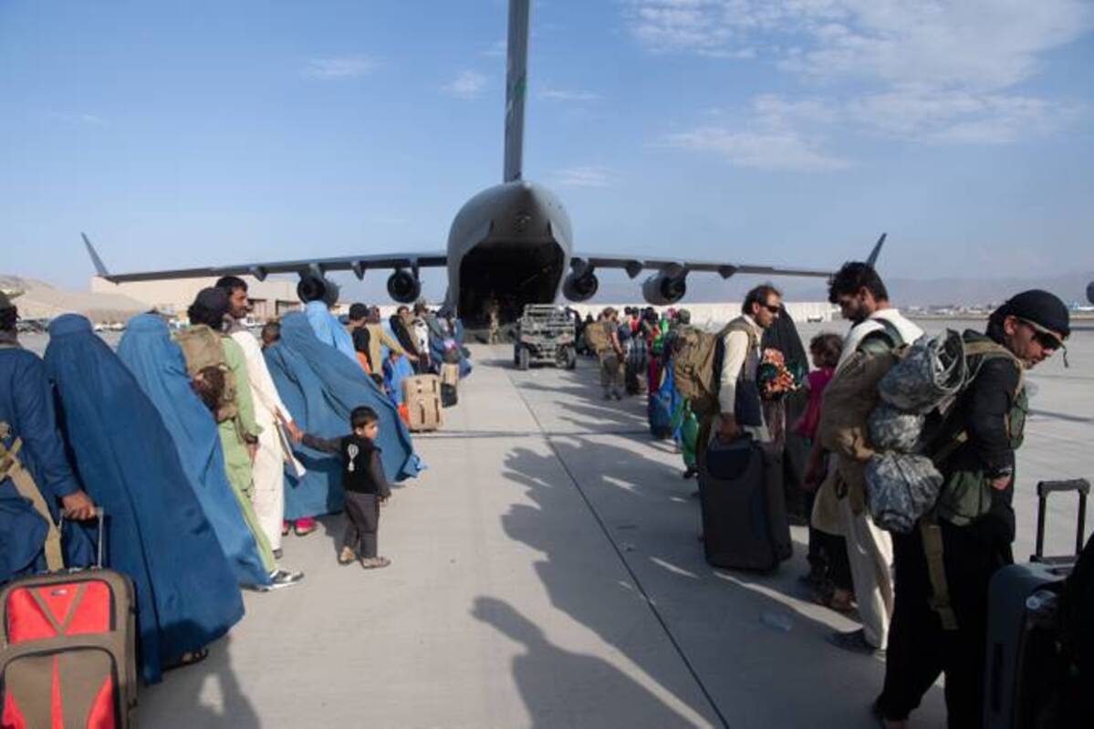 U.S. Air Force loadmasters and pilots assigned to the 816th Expeditionary Airlift Squadron, load passengers aboard a U.S. Air Force C-17 Globemaster III in support of the Afghanistan evacuation at Hamid Karzai International Airport (HKIA) on Aug. 24, 2021, in Kabul. (Master Sgt. Donald R. Allen/U.S. Air Forces Europe-Africa via Getty Images)