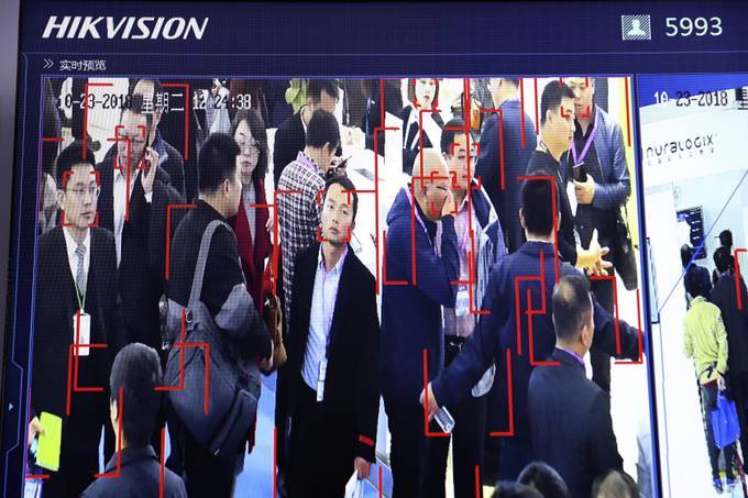 Visitors are tracked by facial recognition technology from state-owned surveillance equipment manufacturer Hikvision. (AP Photo/Ng Han Guan)
