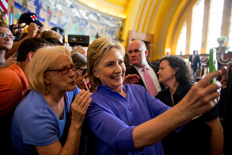 Clinton poses for a selfie&nbsp;in&nbsp;Cincinnati last week.&nbsp;(AP/Andrew Harnik)</p>  