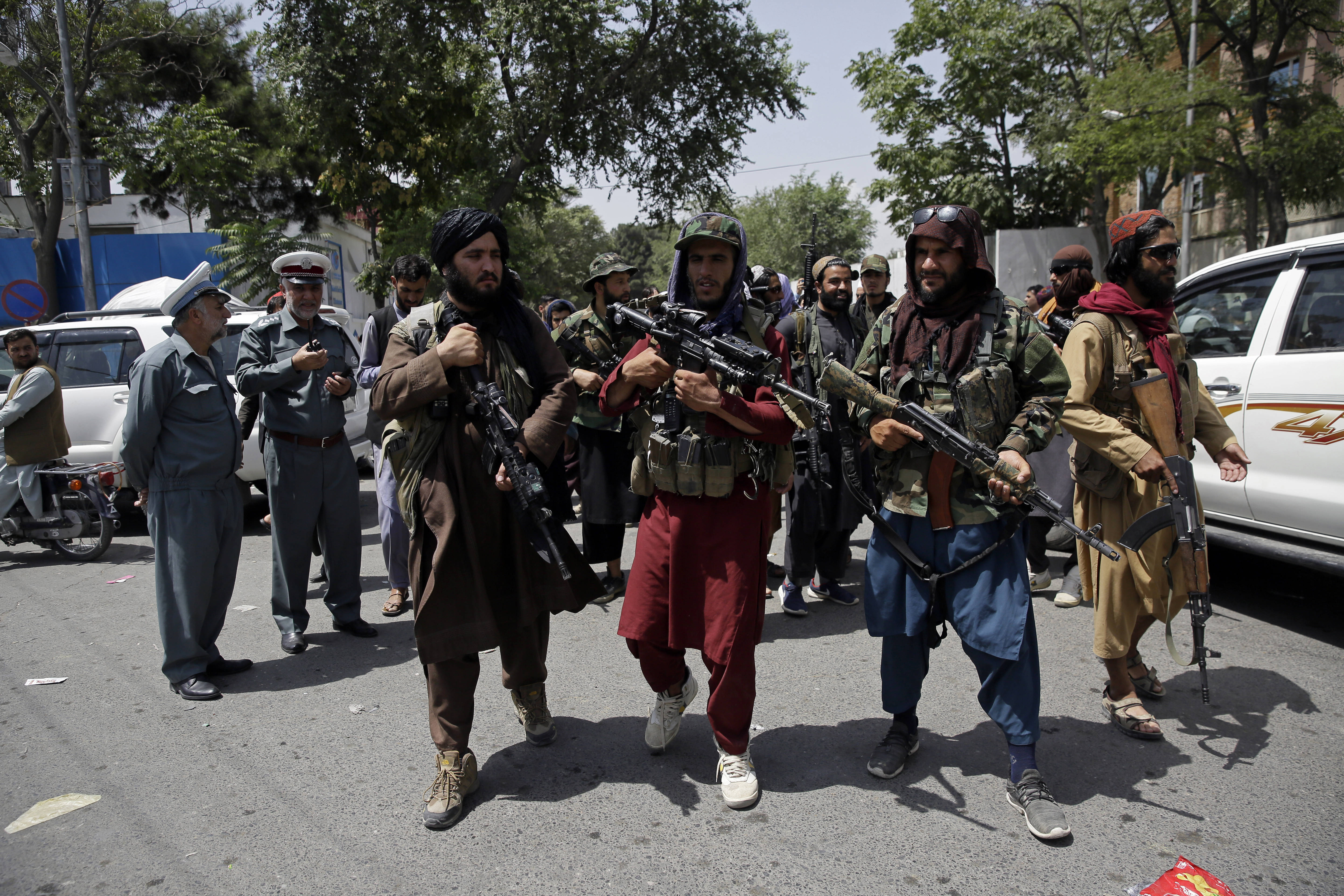 Taliban fighters patrol Kabul on Thursday. (AP Photo/Rahmat Gul)