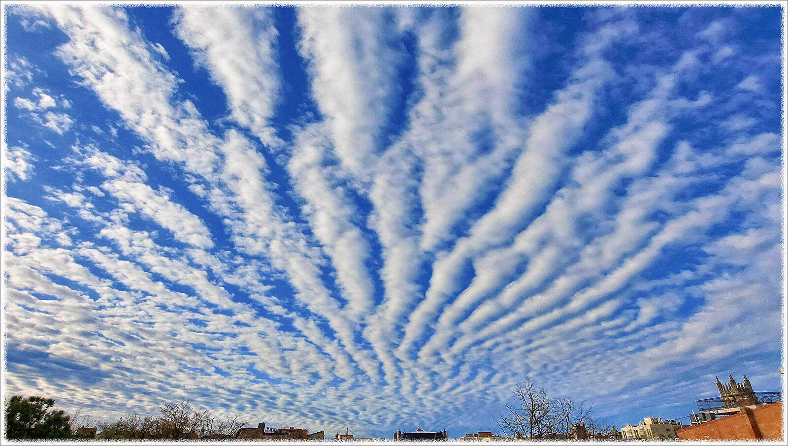 A cloud-painted sky over Washington on Friday morning. (Rex Block/Flickr) (ekkidee/Flickr)