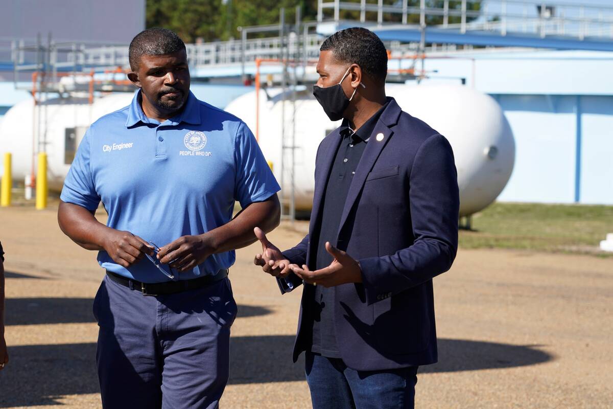 EPA Administrator Michael Regan, right, with city engineer Charles Williams at the O.B. Curtis Water Treatment Plant, a Ridgeland-based facility near Jackson, Miss., in November. (Rogelio V. Solis/AP)