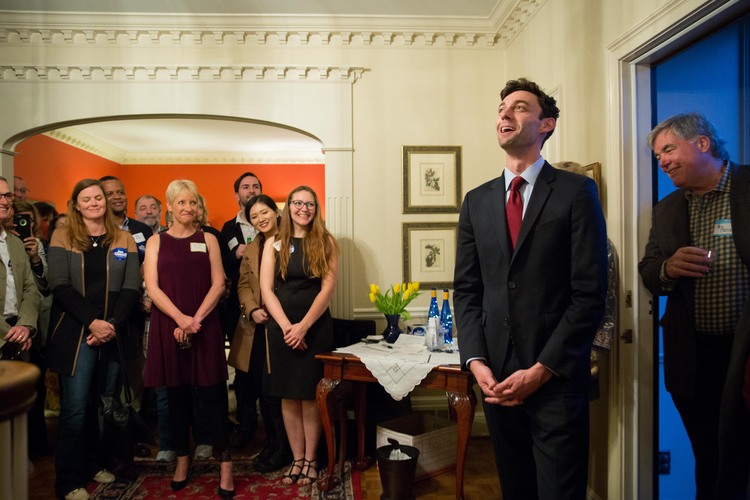 Jon Ossoff talks with supporters at a meet-and-greet in a northern suburb of Atlanta on Friday night. (Kevin D. Liles/For the Washington Post)</p>  