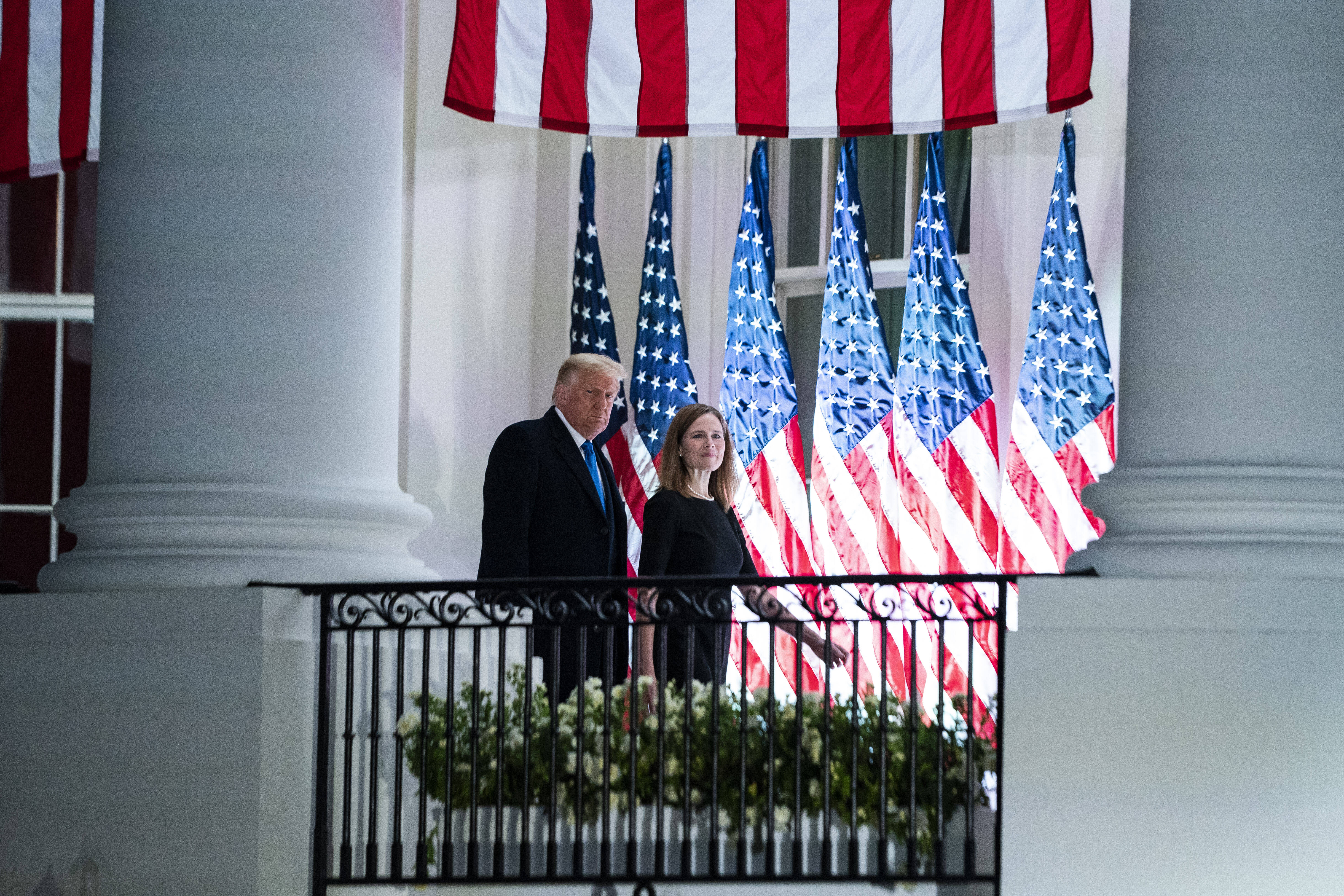 President Donald Trump and Justice Amy Coney Barrett stand outside the White House shortly after she was confirmed to the court. (Jabin Botsford/The Washington Post)