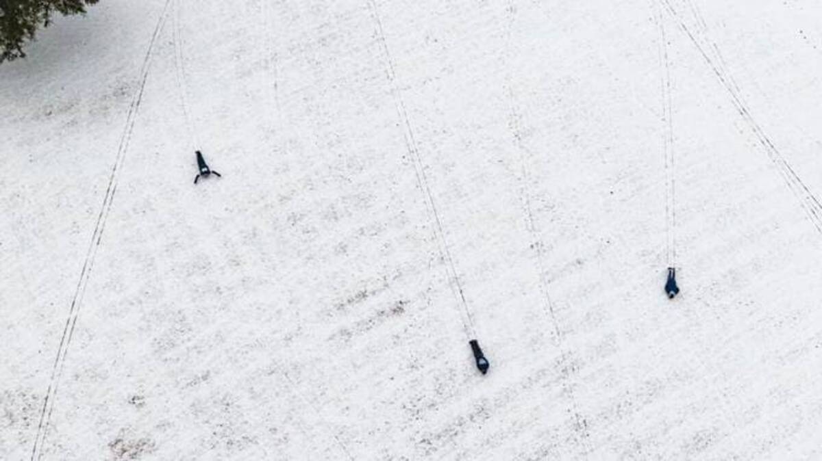 People have a snow day at Flag Pole Hill Park in Dallas on Feb. 3. (Brandon Wade/AP)