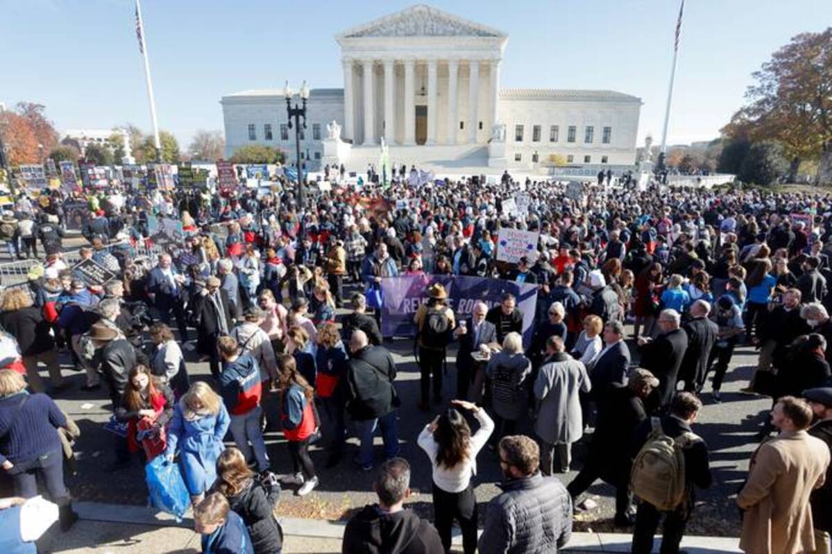 People gather outside the Supreme Court building on the day of arguments in a Mississippi abortion on Dec. 1. (Jonathan Ernst/Reuters)