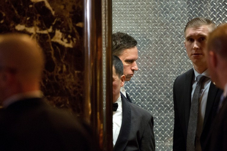 Billionaire tech investor Peter Thiel arrives with his private security detail at Trump Tower last week. (Kevin Hagen/Getty Images)</p>  