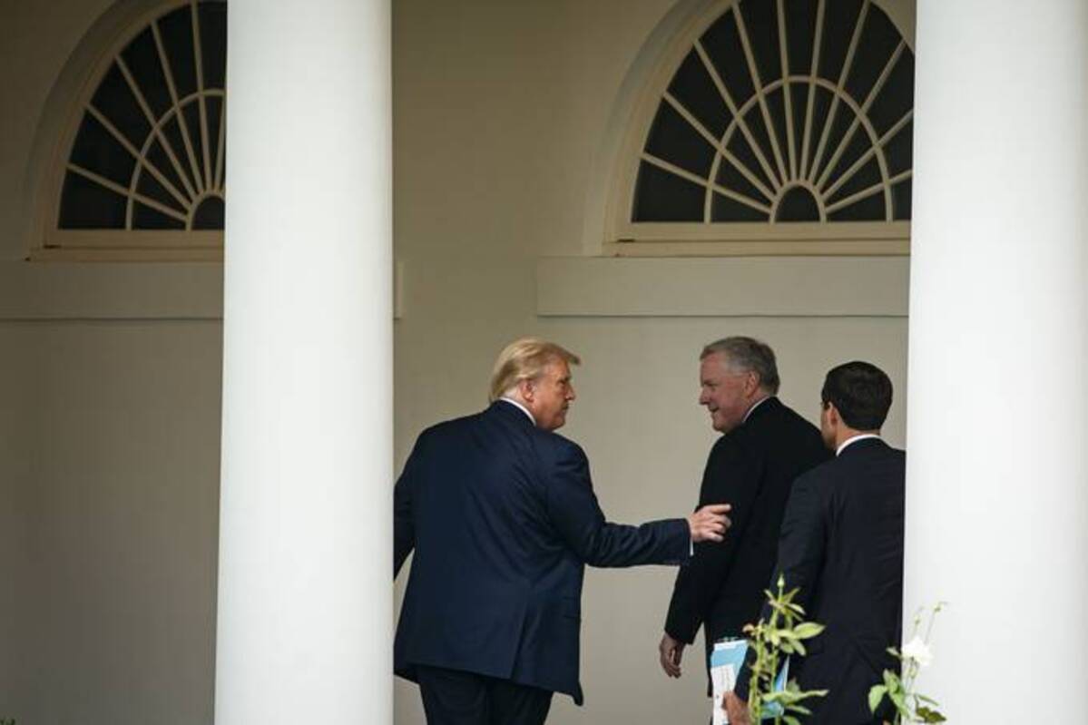 President Donald Trump walks on the West Wing colonnade with White House Chief of Staff Mark Meadows, and John McEntee, White House Director of Presidential Personnel, at the White House, on Sept. 11, 2020. (Al Drago/The Washington Post)