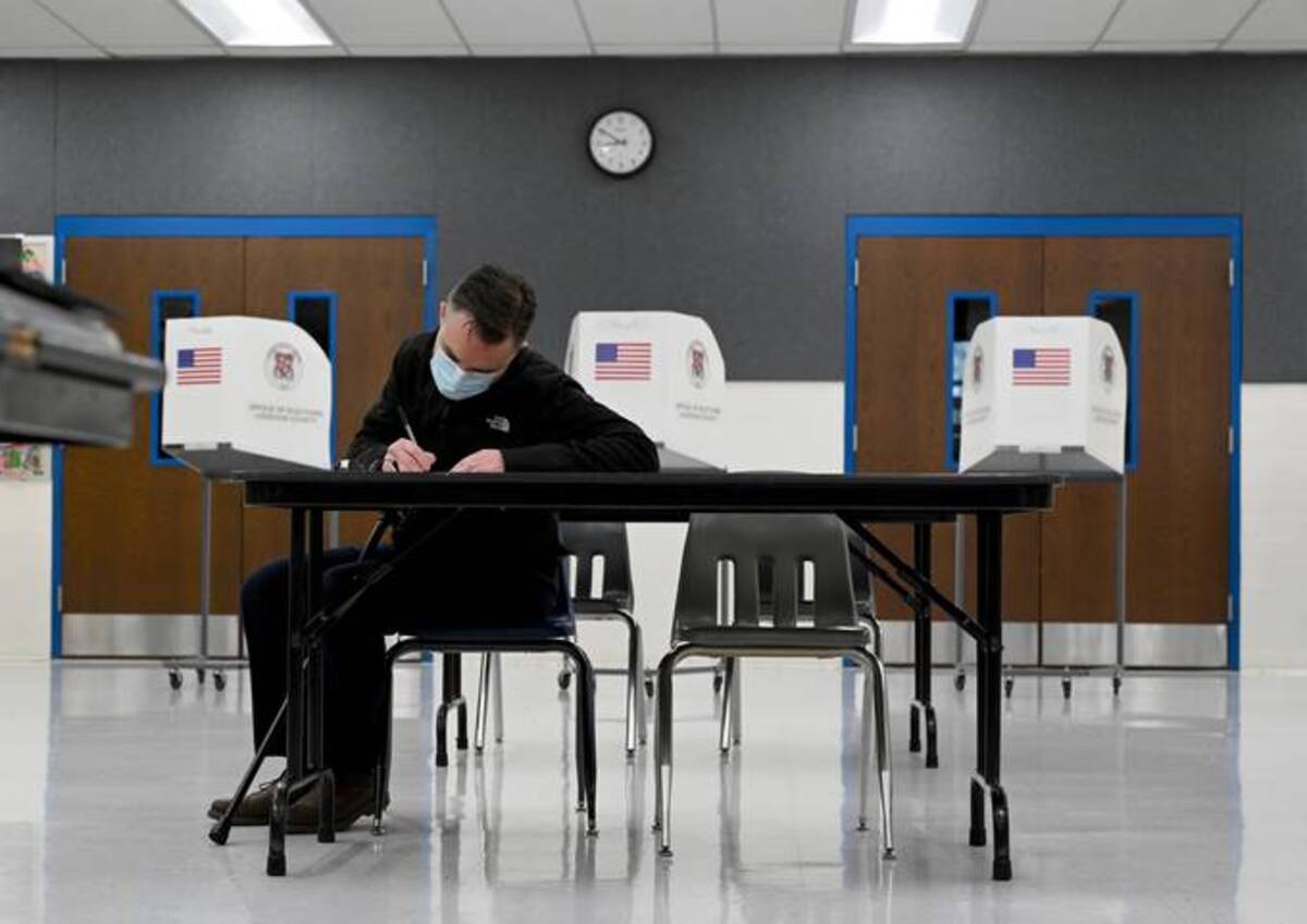 Christopher Murphy casts his ballot at Evergreen Mill Elementary School Tuesday in Leesburg, Va. (Katherine Frey/The Washington Post)