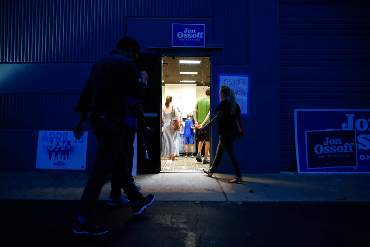 Supporters arrive last night to an election eve rally at Andretti Indoor Karting and Games in Roswell, Georgia. The rally was for Democratic candidate Jon Ossoff. (Kevin D. Liles/Reuters)</p>  