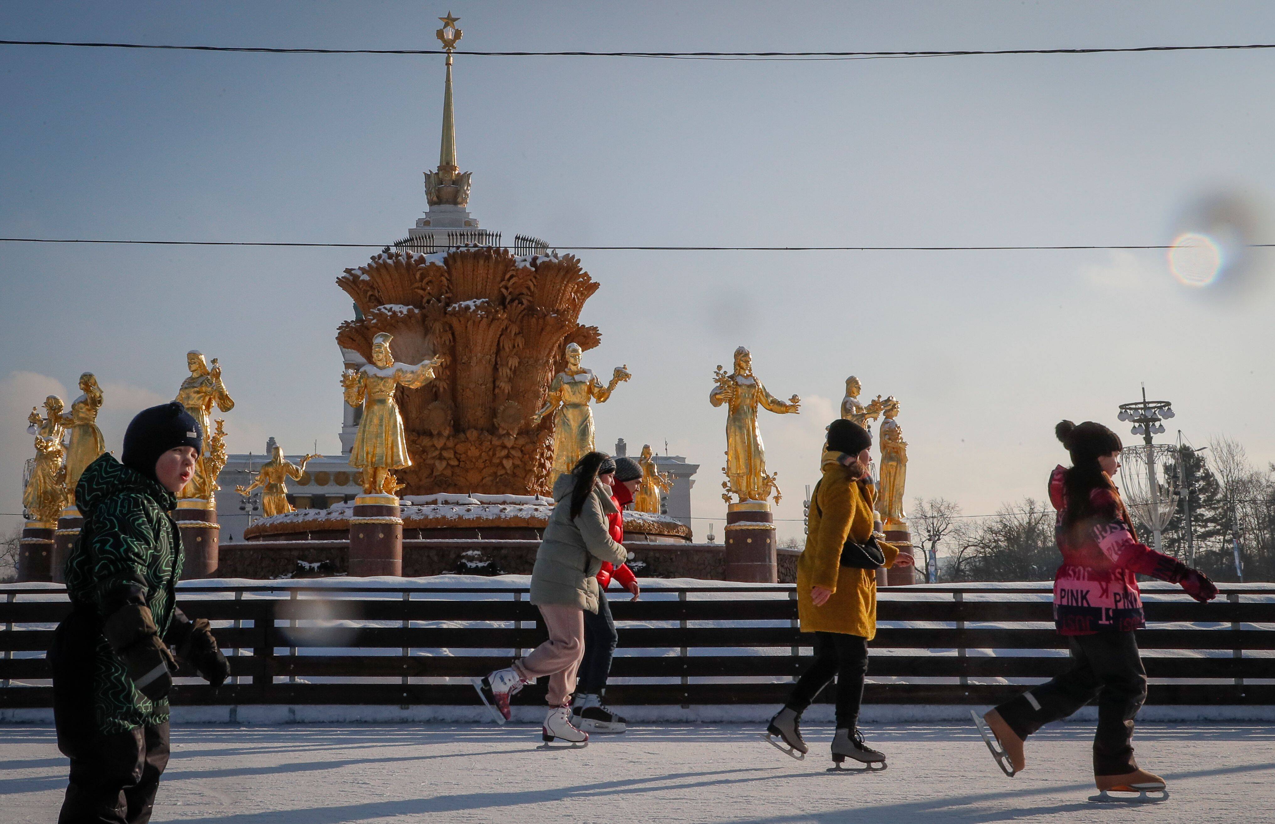 People skating on an ice rink in front of the fountain Druzhba Narodov at the Exhibition of Achievements of National Economy in Moscow on Feb. 5. (Sergei Ilnitsky/EPA-EFE/REX/Shutterstock)