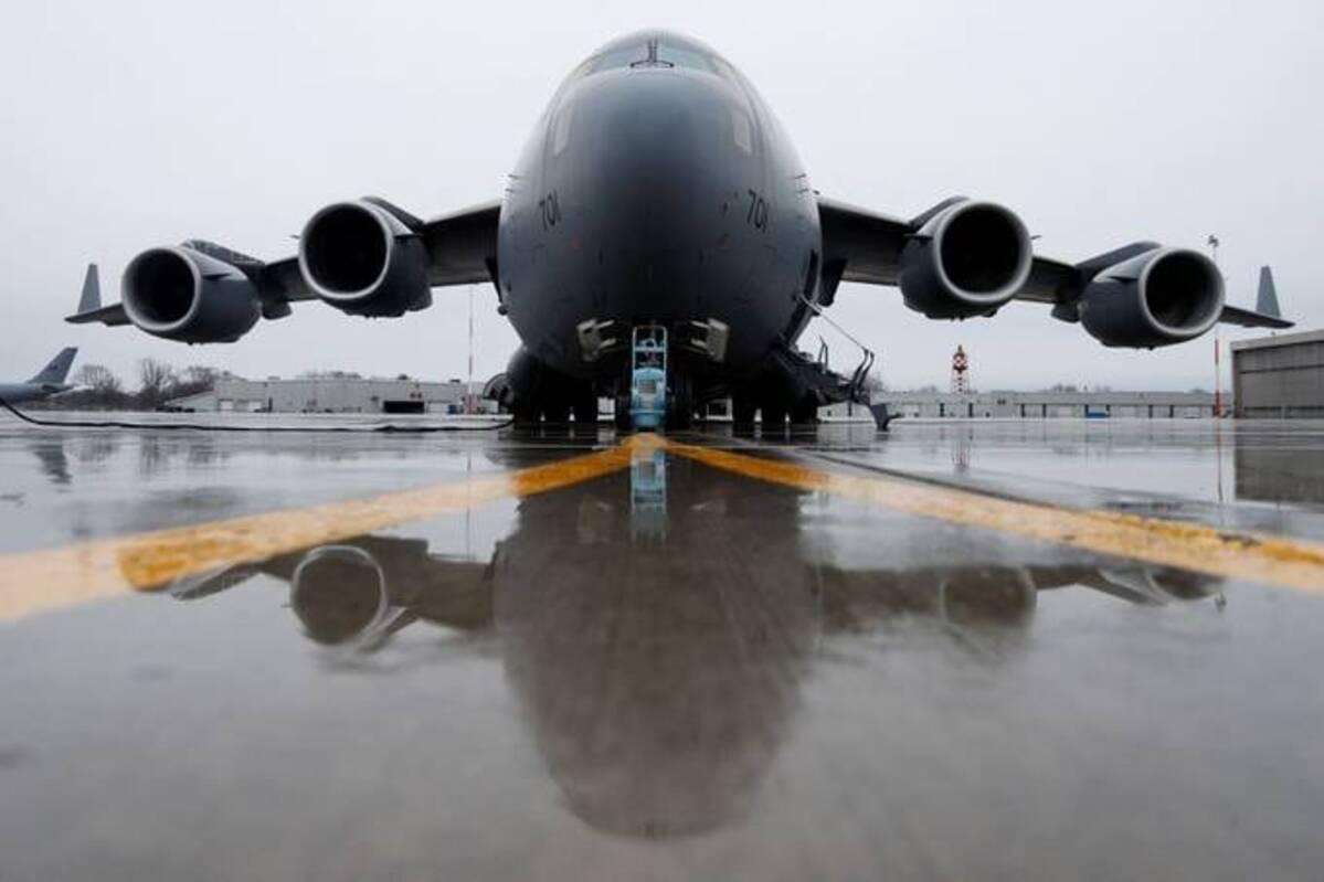 A Royal Canadian Air Force transport aircraft bound for Poland, is loaded with aid to be sent to Ukraine. REUTERS/Lars Hagberg