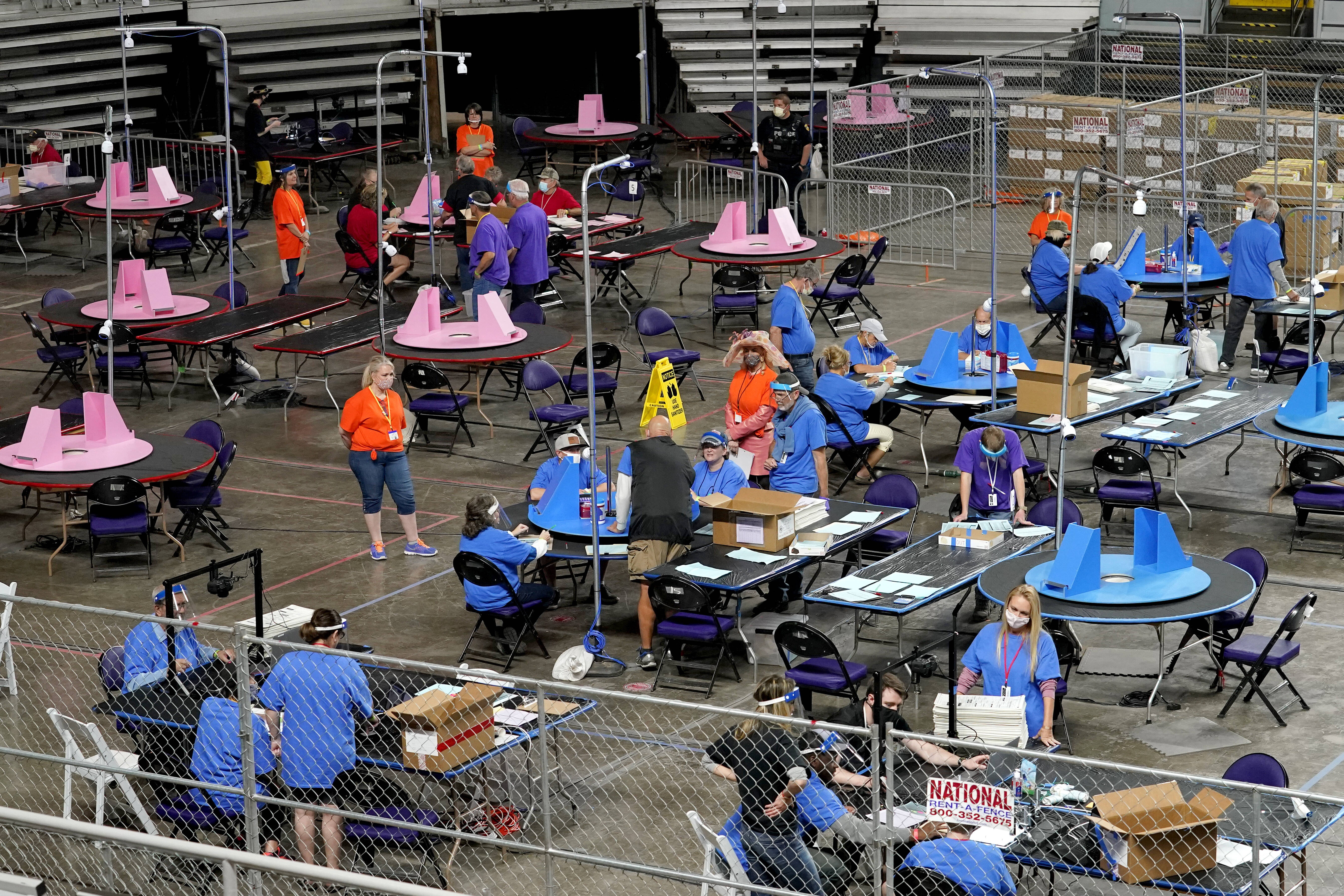 2020 election results in Arizona are counted by workers for a Florida-based company, Cyber Ninjas, in Phoenix. The GOP-backed audit found no evidence of widespread fraud. (AP Photo/Matt York)