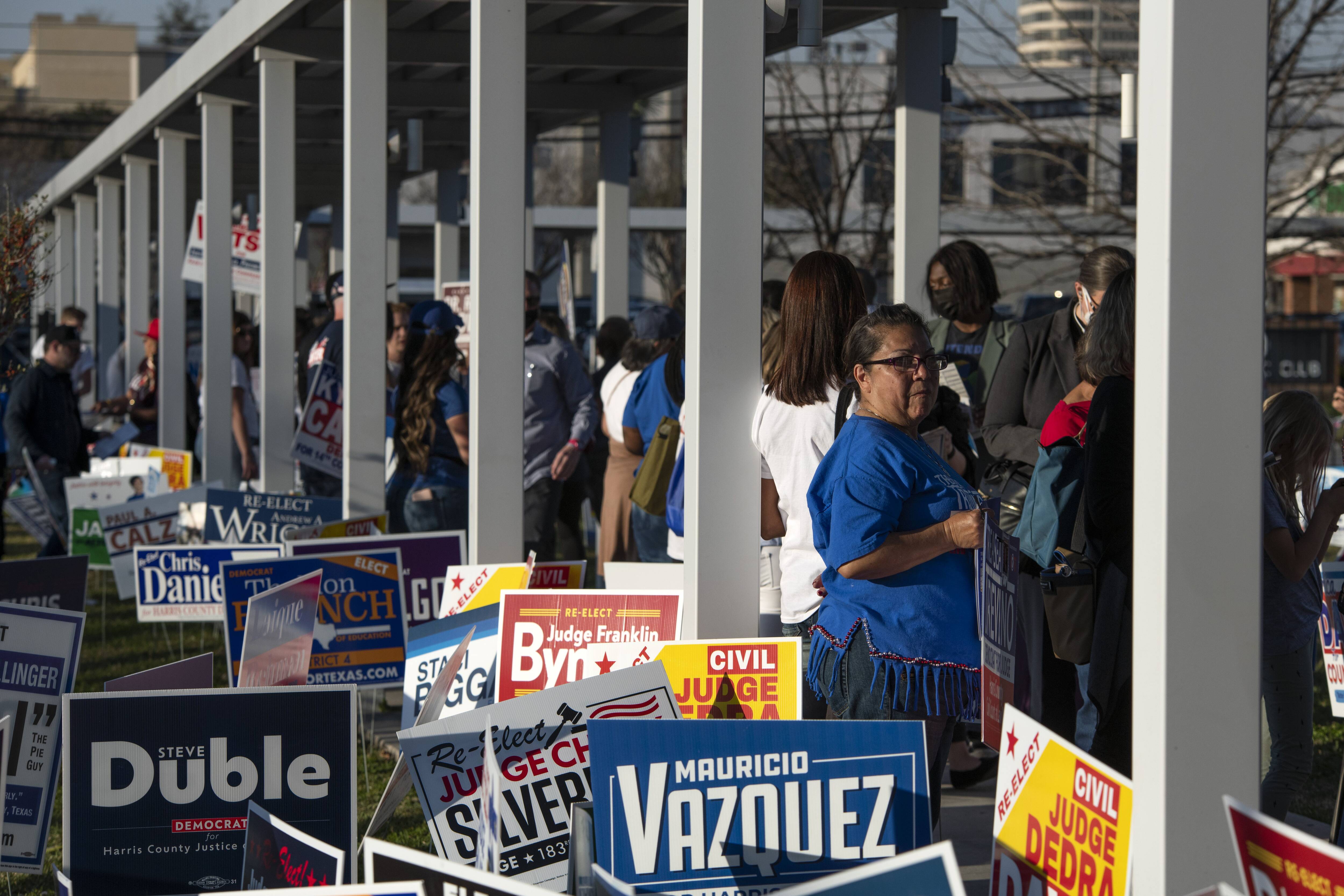 Voters wait in line outside the Metropolitan Multi-Service Center polling place in Houston on March 1. (Mark Felix for The Washington Post)
