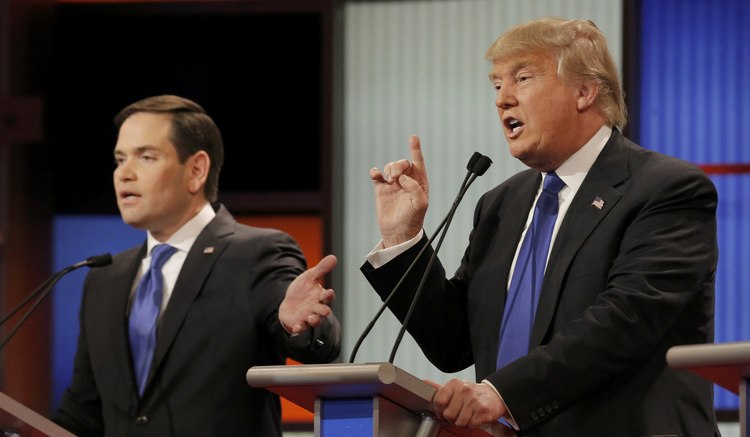 Marco Rubio and Donald Trump speak over each other at the March 3 debate in Detroit. (Jim Young/Reuters)</p>  