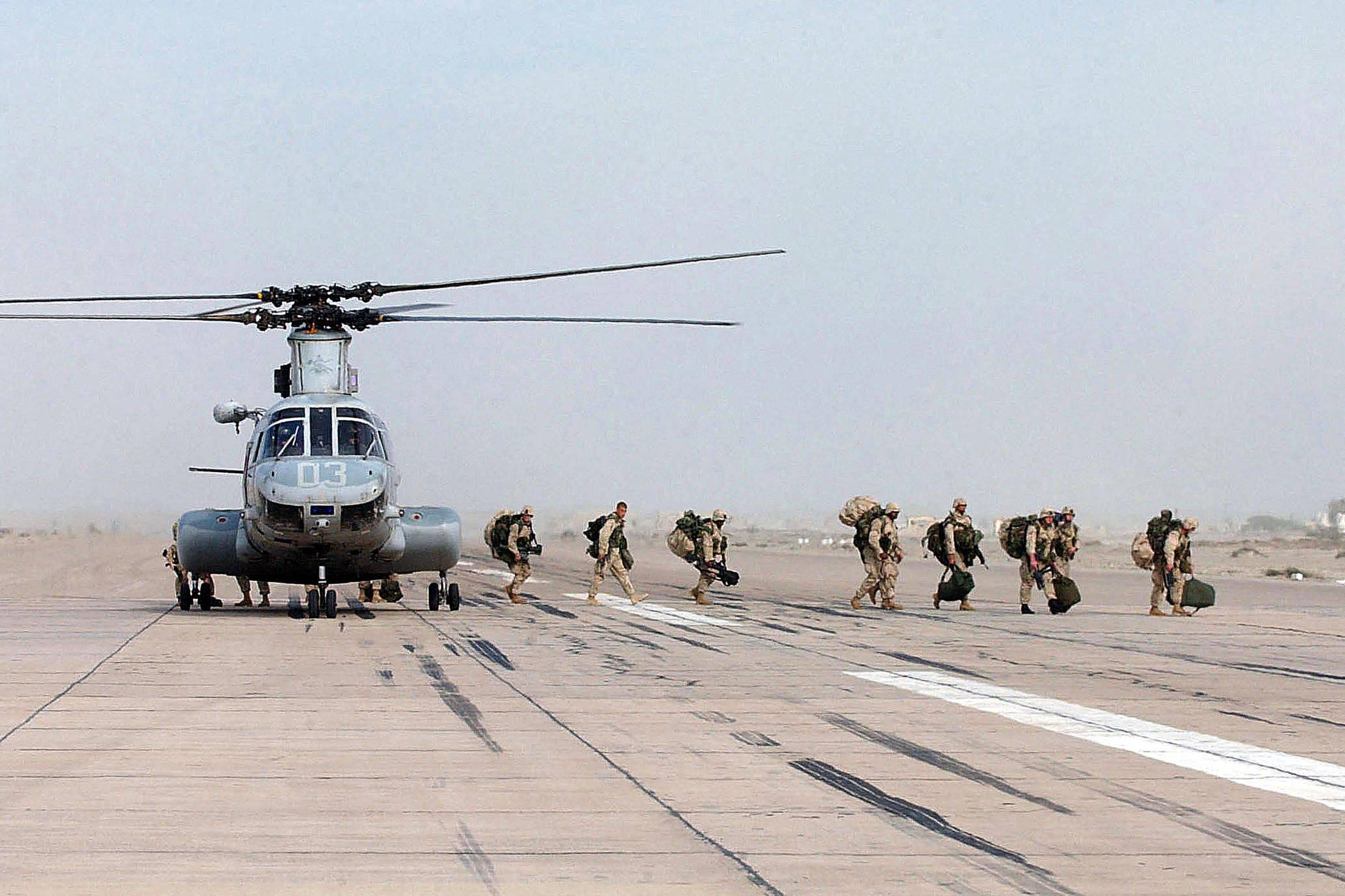 Marines arrive at an undisclosed location in 2001, as the war on terror gets going in earnest. (JOHNNY BIVERA/U.S. NAVY/AFP via Getty Images)
