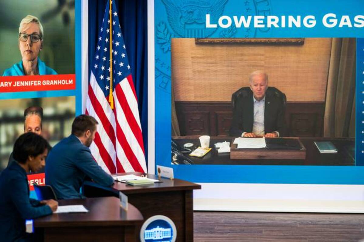 President Biden on screen during a meeting with his economic team to discuss lowering gas prices in the South Court Auditorium of the Executive Office Building on July 22, 2022. (Demetrius Freeman/The Washington Post)