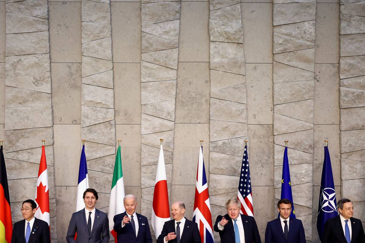 Canada's Prime Minister Justin Trudeau, U.S. President Biden, German Chancellor Olaf Scholz, Britain's Prime Minister Boris Johnson, France's President Emmanuel Macron, Japan's Prime Minister Fumio Kishida and Italy's Prime Minister Mario Draghi pose for a family photo during the G7 summit in Brussels on March 24. (Henry Nicholls/Reuters, Pool)