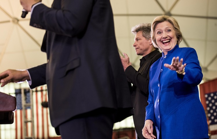 Hillary,&nbsp;with singer-songwriter Jon Bon Jovi,&nbsp;in Newark yesterday.&nbsp;(Photo by Melina Mara/The Washington Post)</p>  