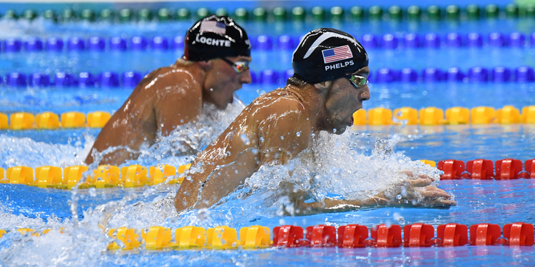 Michael Phelps pulls away from Ryan Lochte to win the 200m IM Gold yesterday.&nbsp;(Photo by Jonathan Newton/The Washington Post)</p>  