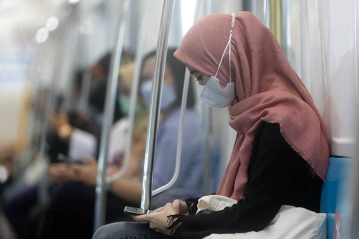A worker in Jakarta, Indonesia, where travelers from eight countries are now prohibited due to the omicron variant. Mandatory Credit: Photo by ADI WEDA/EPA-EFE/Shutterstock