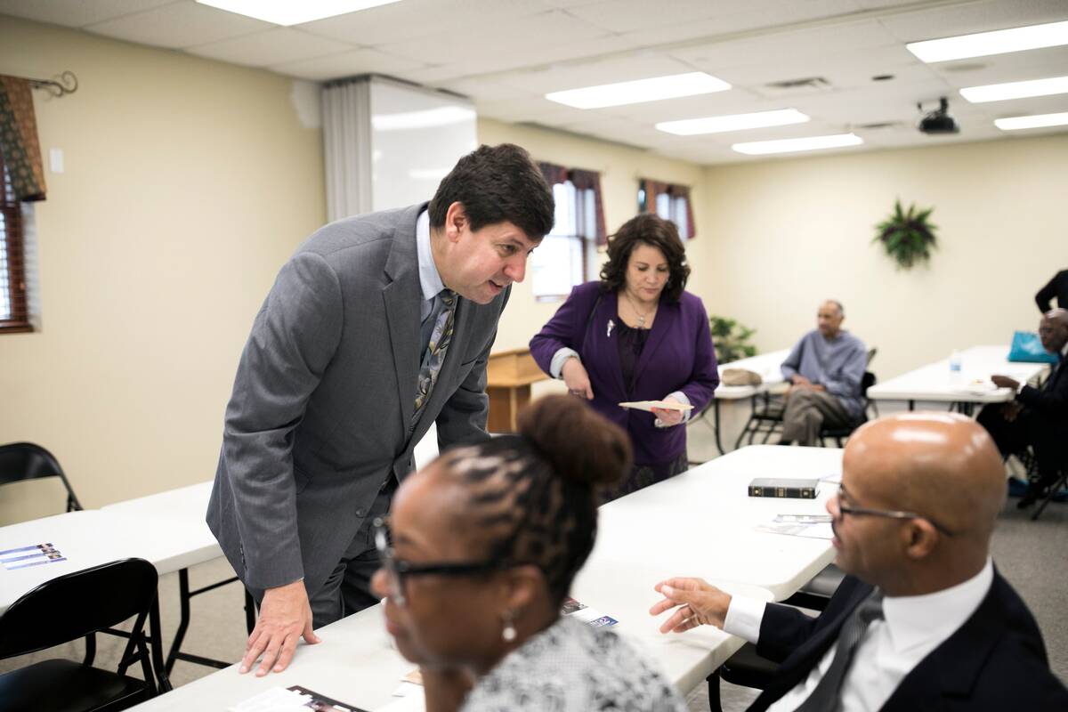 Steve Dettelbach talks with people before speaking at a breakfast with faith and community leaders in Cincinnati, Ohio. (Maddie McGarvey/The Washington Post)