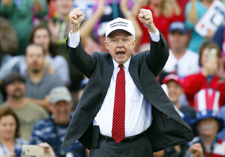 Jeff Sessions, poised to become the country's chief law enforcement officer, gins up the crowd at Trump's thank-you rally in Mobile, Ala., last month. (AP/Brynn Anderson)</p>  