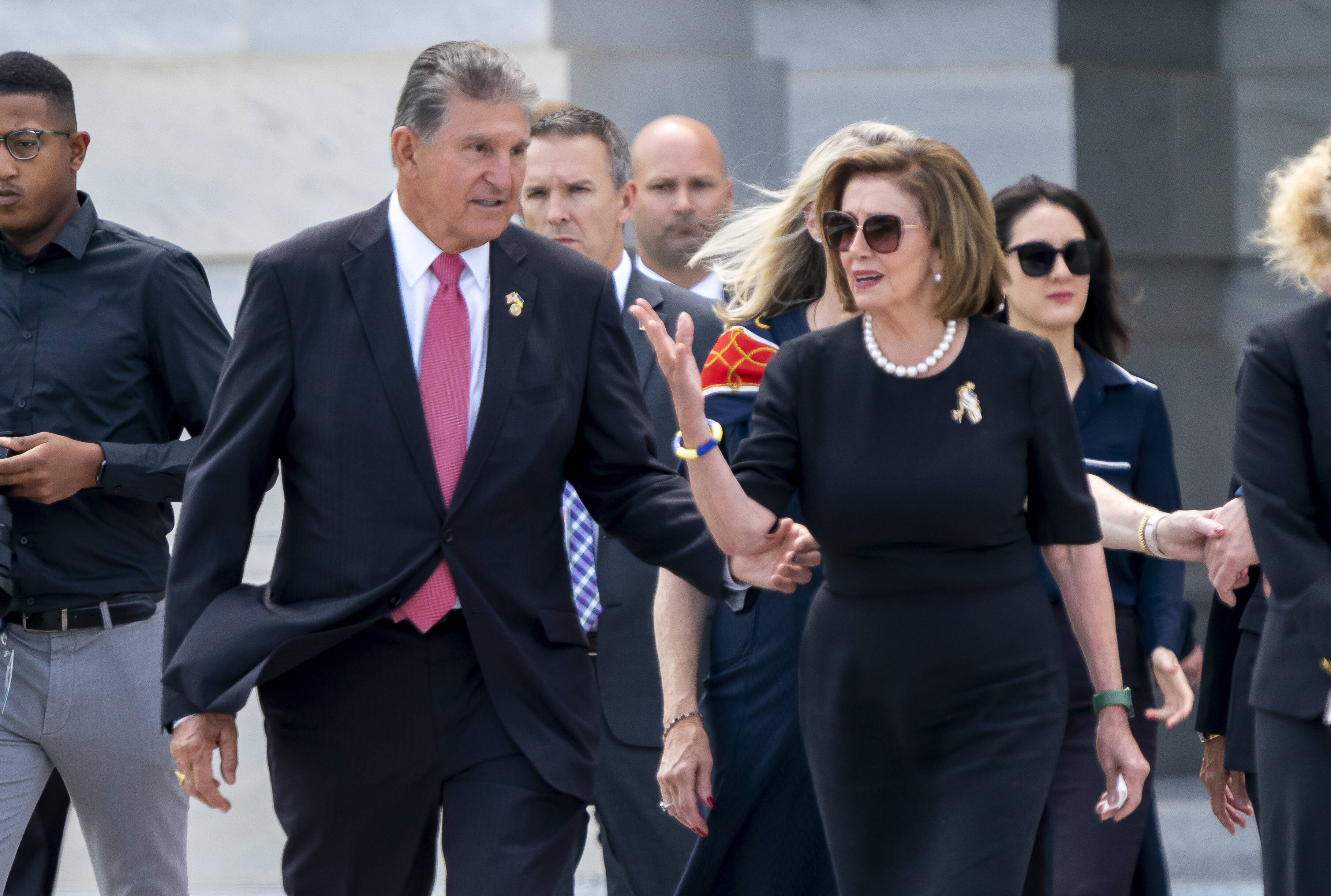 Sen. Joe Manchin (D-W. Va.) with House Speaker Nancy Pelosi (D-Calif.) earlier in the week. (J. Scott Applewhite/AP)