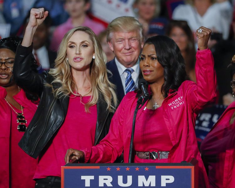 Trump participates in a rally with daughter-in-law Lara Trump (L) and Omarosa Manigault (R) in Charlotte last month. (Erik S. Lesser/Reuters)</p>  