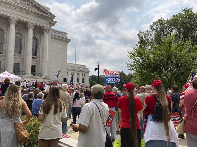 People cheer Wisconsin state Rep. Janel Brandtjen (R) outside the Capitol in Madison after she announced that she has issued subpoenas for election materials from Milwaukee and Brown counties as part of a "cyber-forensic audit" of the state's 2020 presidential election results. (Todd Richmond/AP)