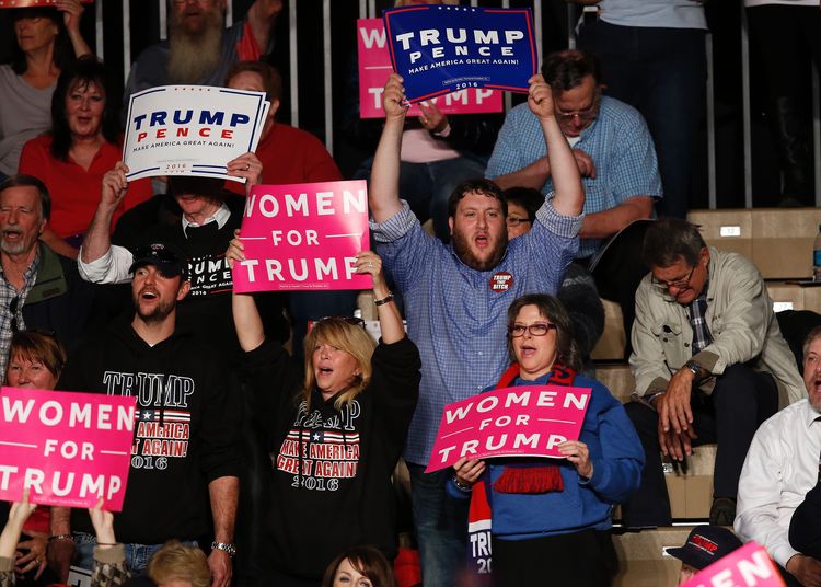 Supporters cheer Trump at Macomb Community College on October 31. (Jeff Kowalsky/AFP/Getty Images)</p>  