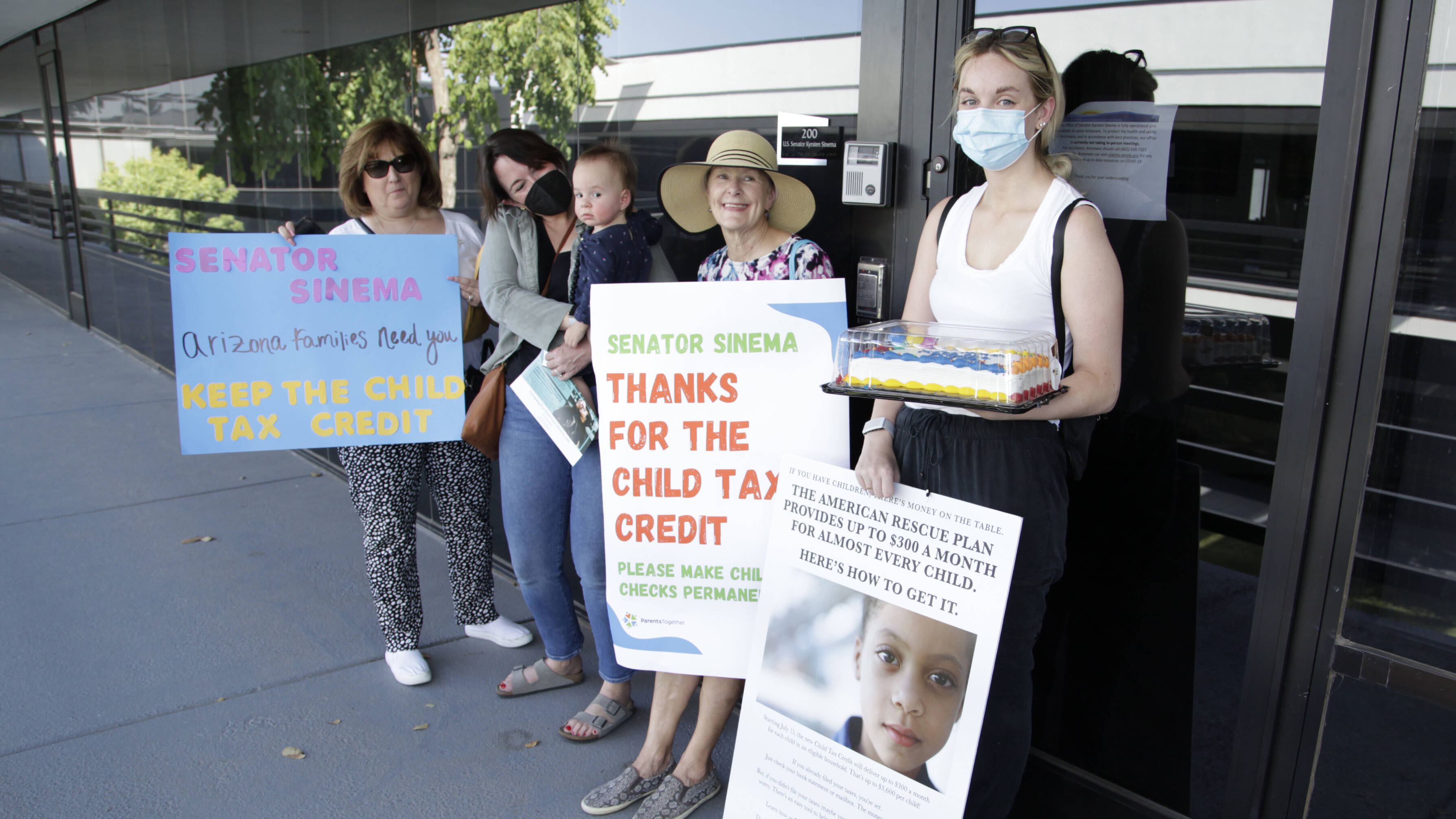 Demonstrators outside the Phoenix office of Sen. Kyrsten Sinema (D-Ariz.) this month.