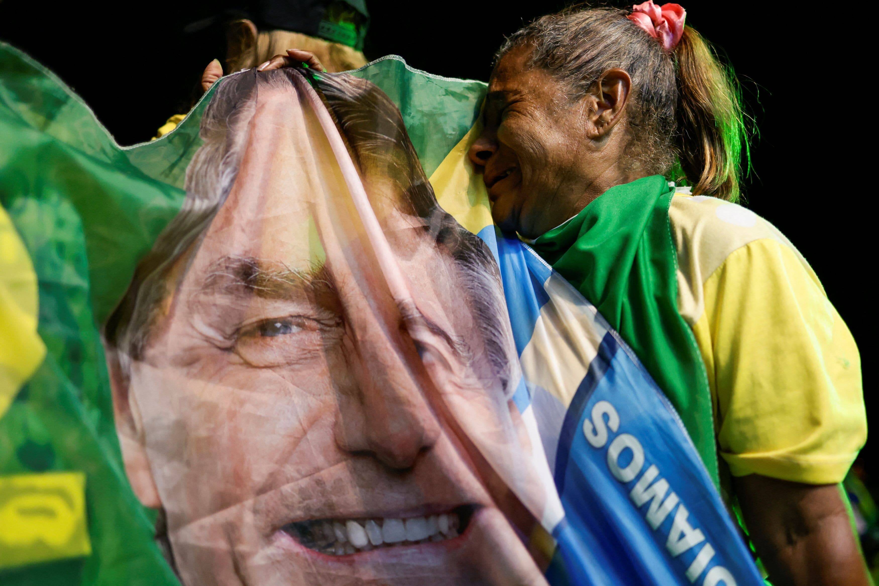 A supporter of Brazil's President and presidential candidate, Jair Bolsonaro, cries on Oct. 30. (Ueslei Marcelino/Reuters)