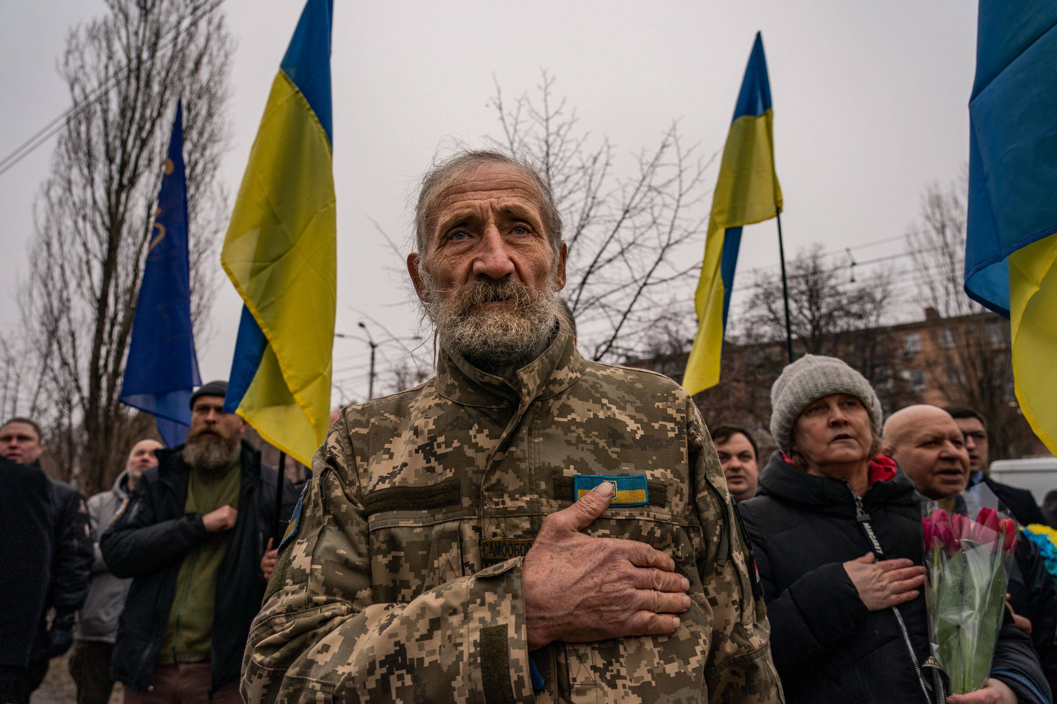 Valeriy Kocherga, 75, join other Ukrainians as they gather for the annual commemoration of the victims of the 2015 Kharkiv bombing in Kharkiv, Ukrain on Feb. 22. (Salwan Georges/The Washington Post)