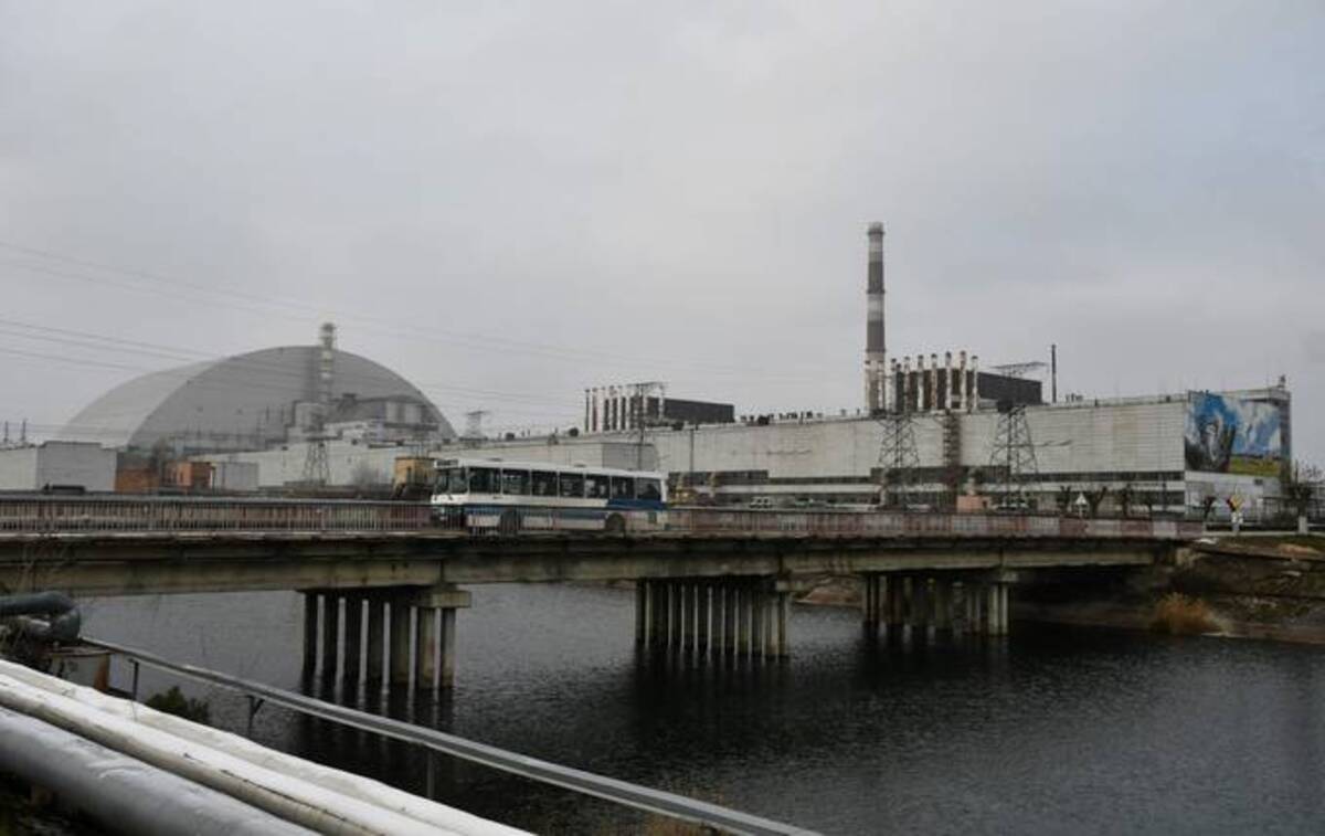 A general view of Chernobyl nuclear power plant and giant protective dome built over the sarcophagus of the destroyed fourth reactor. (Photo by GENYA SAVILOV/AFP via Getty Images)