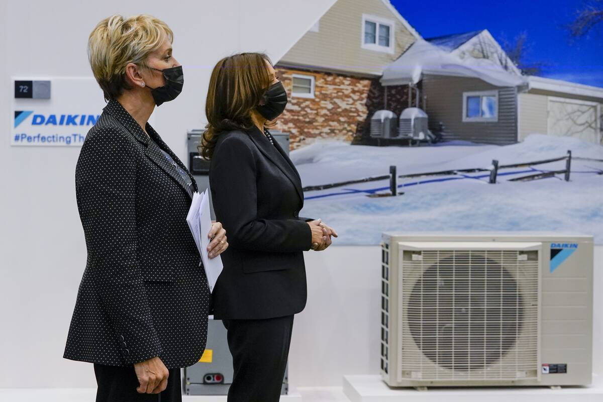 Vice President Harris and Energy Secretary Jennifer Granholm listen to a presentation on heat pumps last year in New York. (Mary Altaffer/AP)
