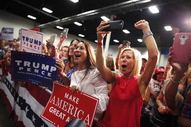 Trump supporters cheer as he speaks&nbsp;at a campaign rally in Fredericksburg, Va.&nbsp;(AP/Gerald Herbert)</p>  