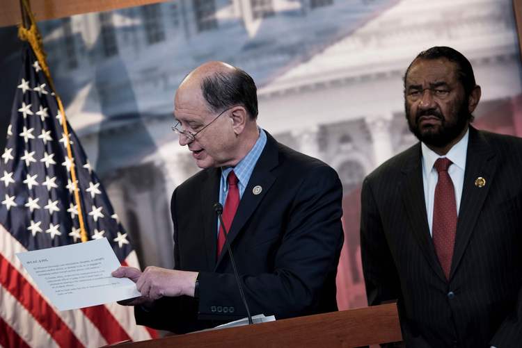 Rep.&nbsp;Brad Sherman (D-Calif.) and Rep.&nbsp;Al Green (D-Tex.) take questions about articles of impeachment last week. (Brendan Smialowski/AFP/Getty Images)</p>  