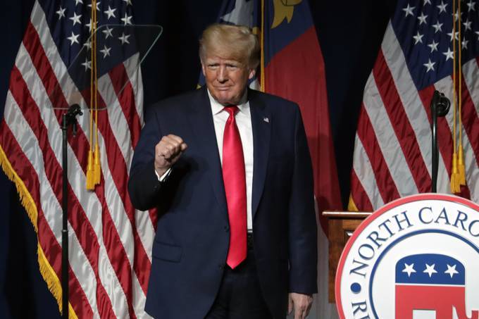 Former president Trump acknowledges the crowd at the North Carolina Republican Convention over the weekend in Greenville, N.C. (AP Photo/Chris Seward)