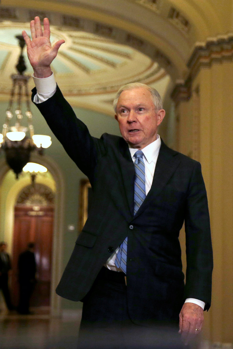Attorney General nominee Jeff Sessions waves to reporters after meeting with Senate Majority Leader Mitch McConnell on Nov. 30. (Gary Cameron/Reuters)</p>  