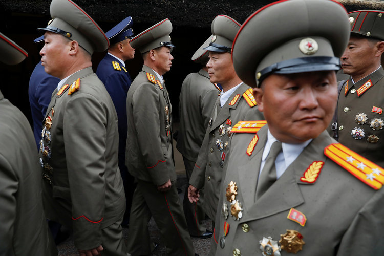 Military officers visit the birthplace of North Korean founder Kim Il Sung this morning, a day before the 105th anniversary of his birth, in Mangyongdae, just outside Pyongyang. (Damir Sagolj/Reuters)</p>  