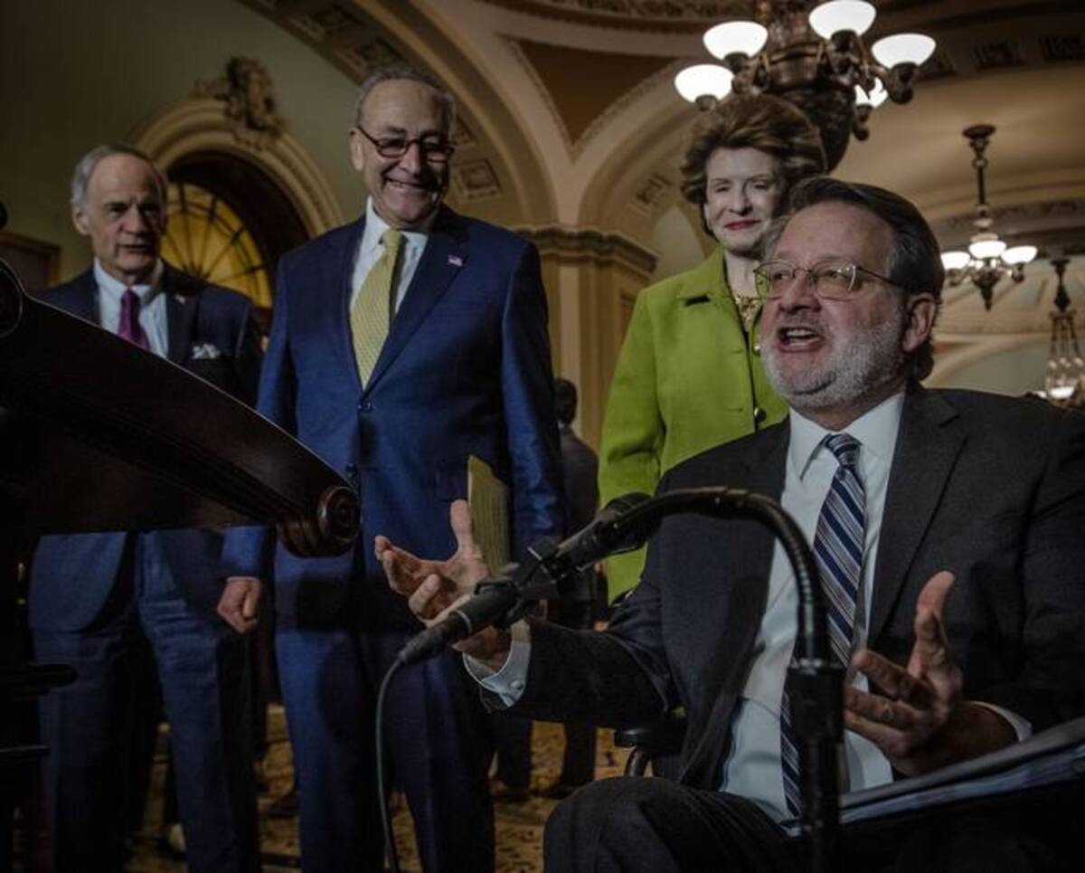 Sen. Gary Peters (D-Mich.) speaking Tuesday at the U.S. Capitol. (Photo by Bill O'Leary/The Washington Post)