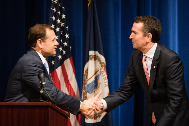 Tom Perriello, left, shakes hands with Ralph Northam at a debate. (Sarah L. Voisin/The Washington Post)</p>  