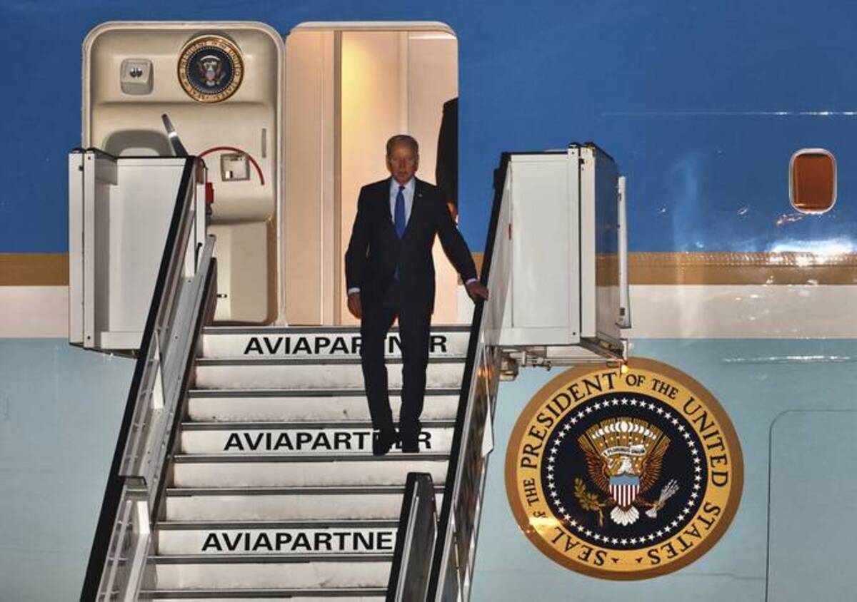 President Biden steps off Air Force One as he arrives at Melsbroek military airport in Brussels on Wednesday. (AP Photo/Olivier Matthys)