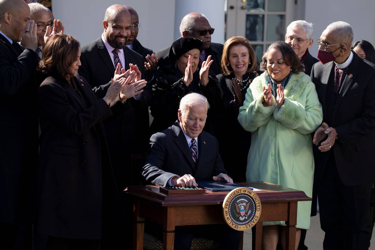 President Biden signs the Emmett Till Antilynching Act into law during a ceremony in the Rose Garden on Tues., March 29. (Michael Reynolds/EPA-EFE/Shutterstock)
