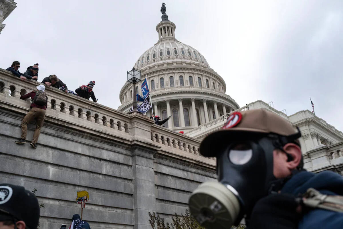 A mob of Donald Trump supporters storms the Capitol on Jan. 6, 2021. (Michael Robinson Chavez/The Washington Post)