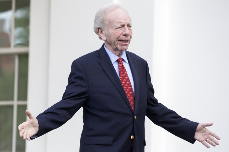 Joe Lieberman walks out of the West Wing after his job interview with Trump to run the FBI. (Michael Reynolds/EPA)</p>  
