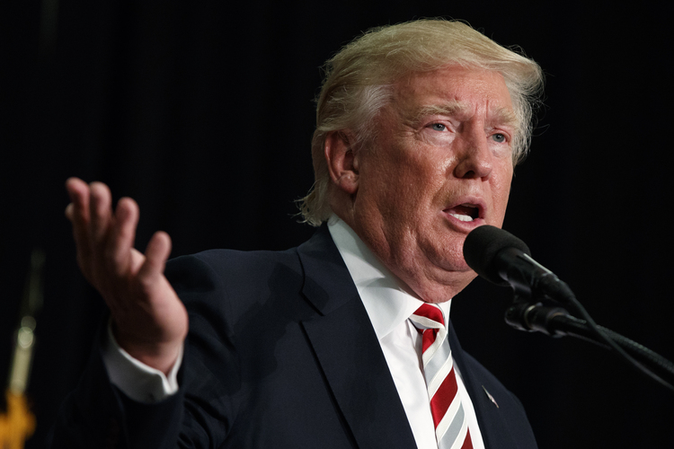 Donald Trump speaks Saturday&nbsp;night during a campaign rally at Windham High School&nbsp;in New Hampshire.&nbsp;(Evan Vucci/AP)</p>  