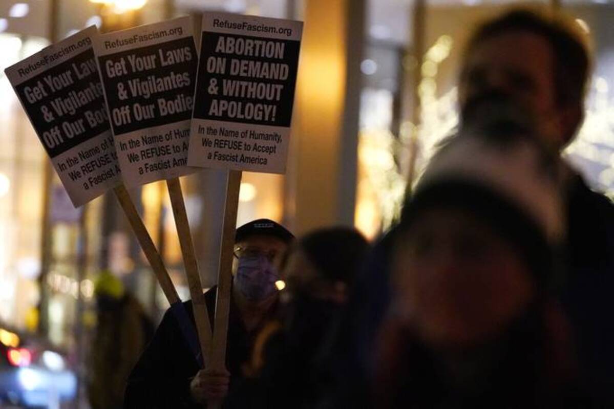 Supporters hold up signs during an abortion rights rally Wednesday outside Federal Plaza in Chicago. (Nam Y. Huh/AP)