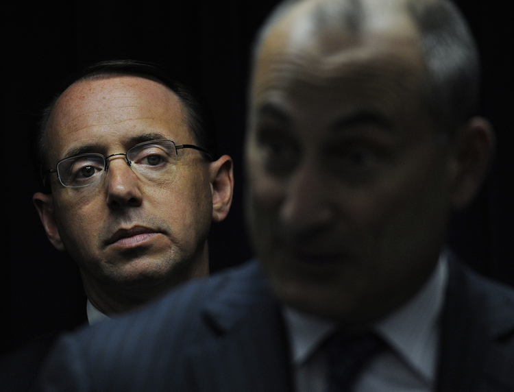 Rod Rosenstein (L) listens during a press conference. (Michael S. Williamson/The Washington Post)</p>  